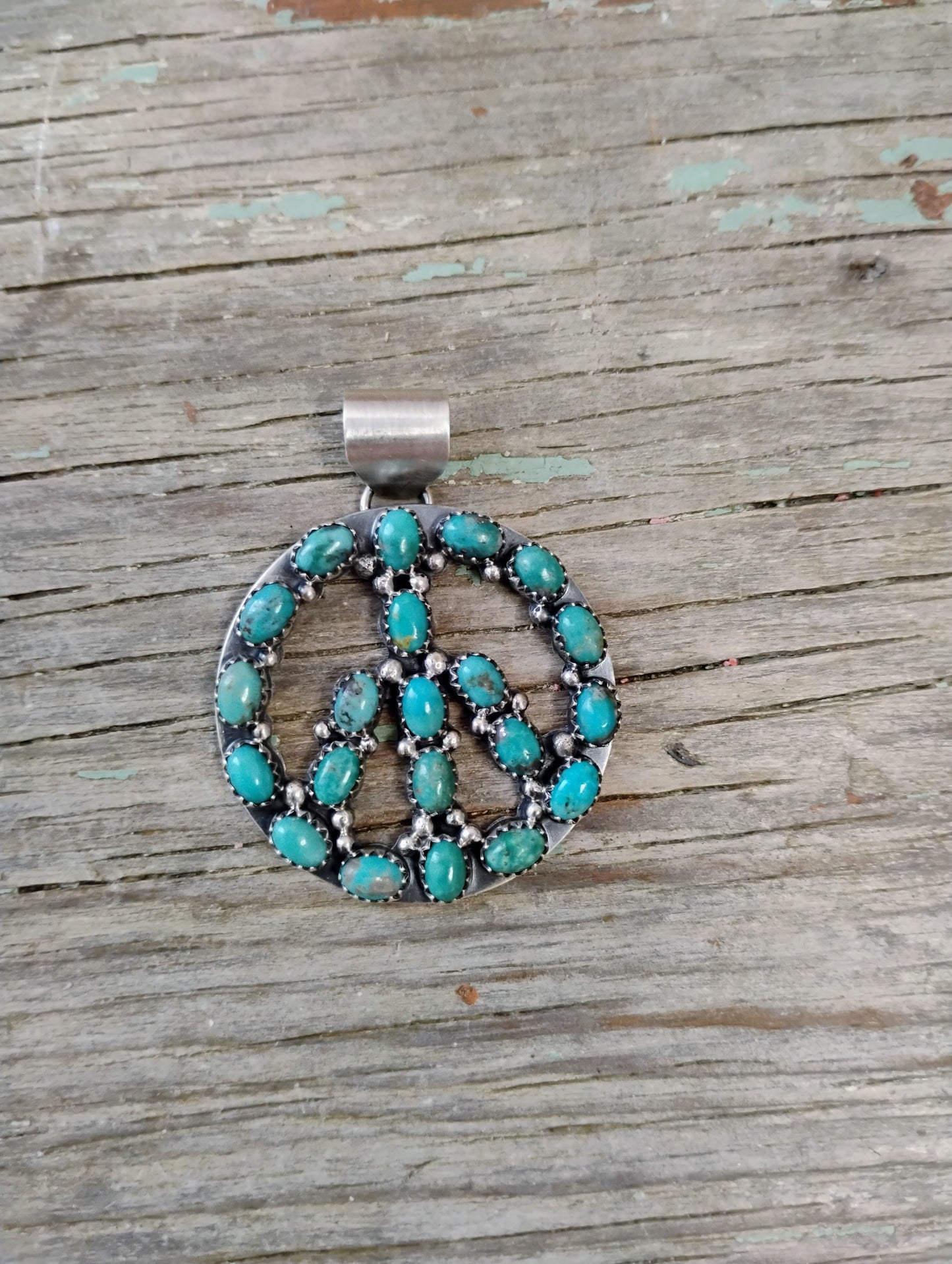Turquoise peace sign